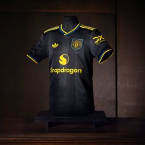 Manchester United 2025/26 Adidas Third Jersey in black with red lightning details, celebrating the club’s bold heritage and unstoppable energy.